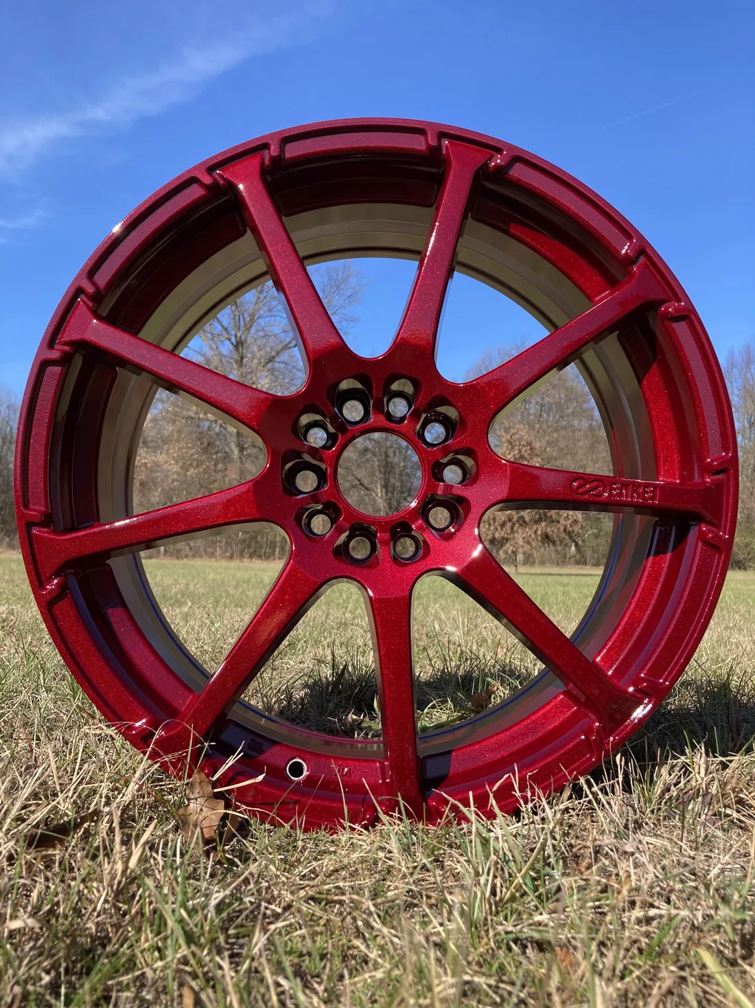 An illusion cherry metallic powder coated wheel